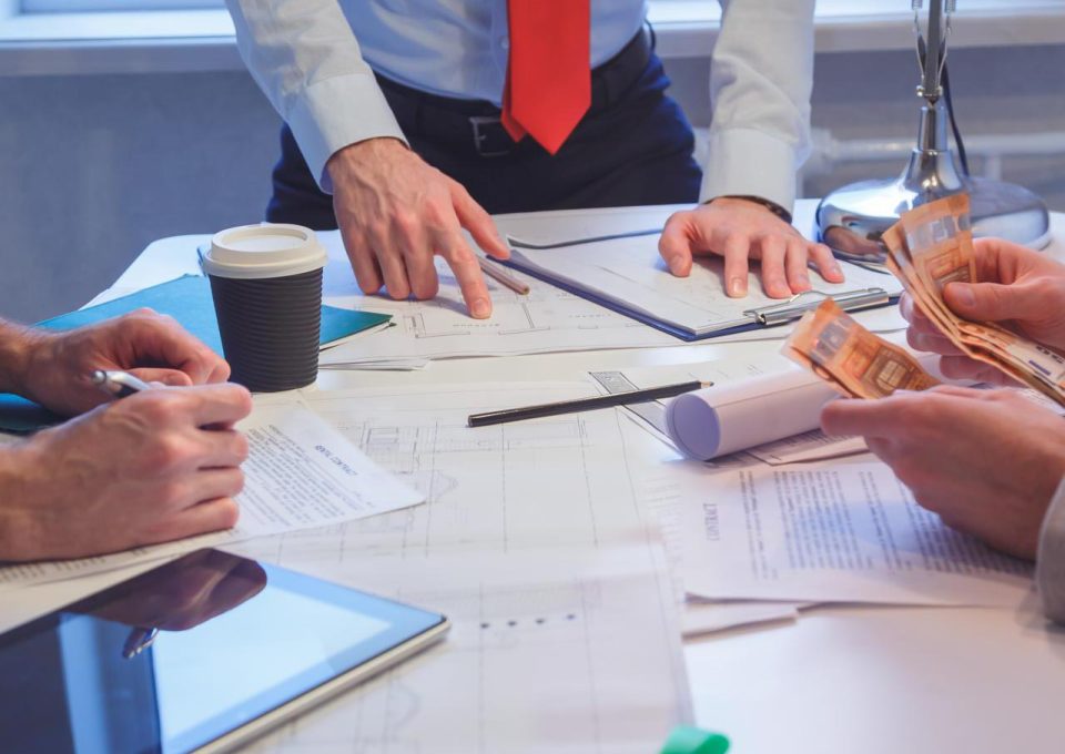 close-up-of-business-people-discussing-a-financial-AB94SZ2-compressed-square.jpg